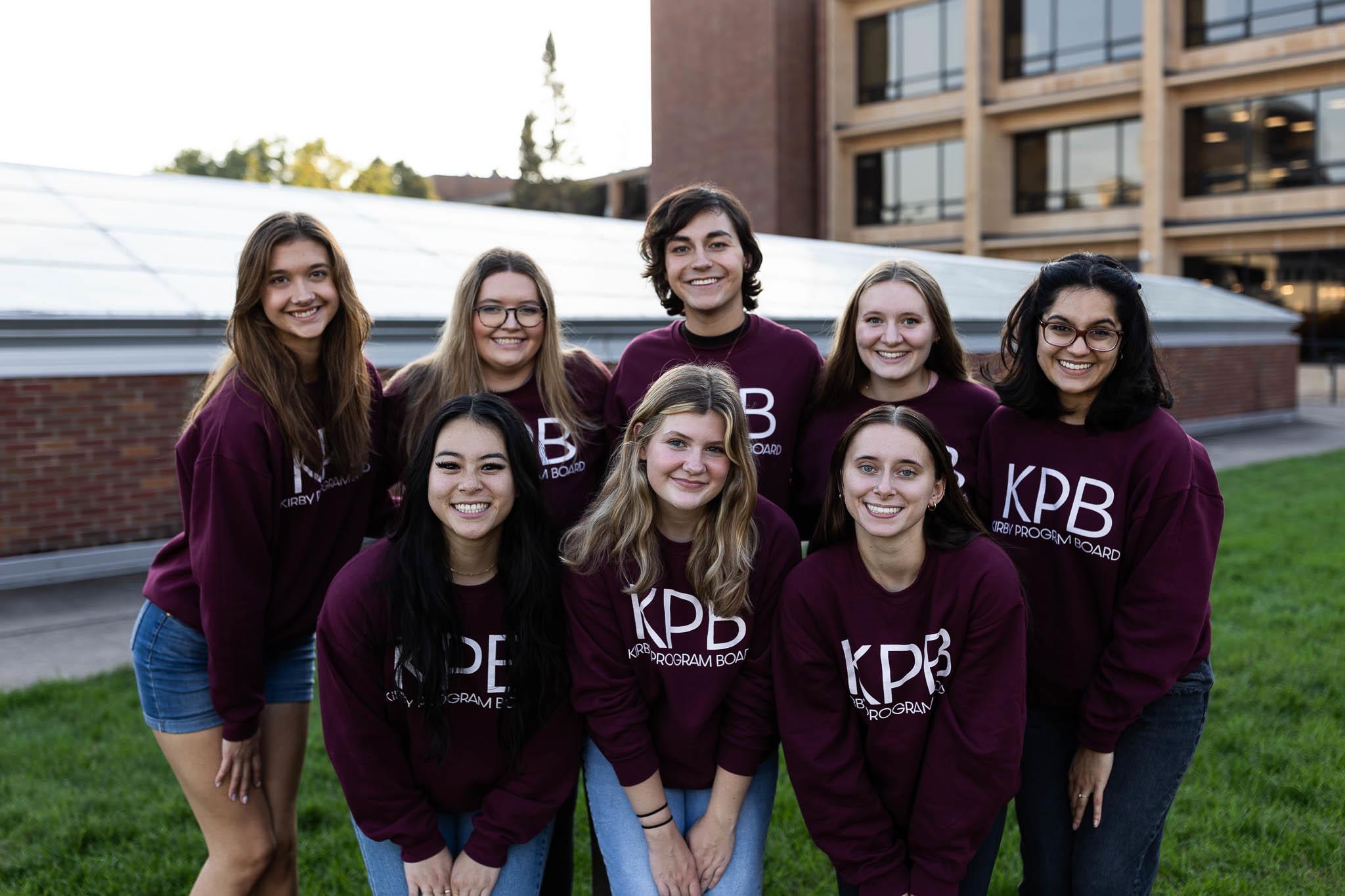 8 students with "KPB" sweatshirts